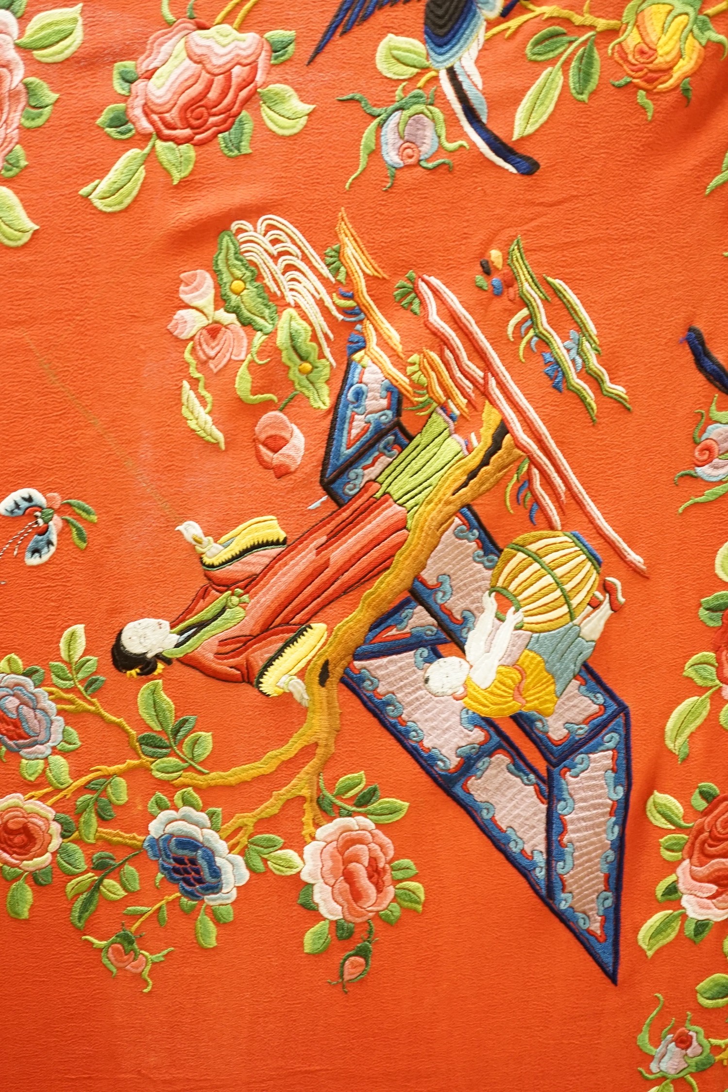 A Chinese early 20th century silk crepe, polychrome embroidered shawl